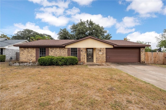 single story home with a front lawn and a garage