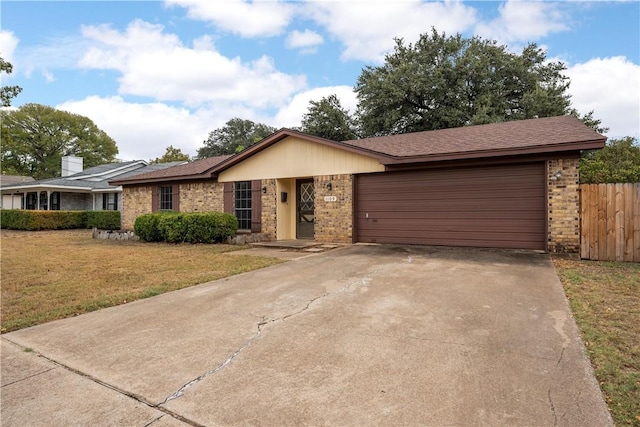 ranch-style home featuring a garage and a front lawn