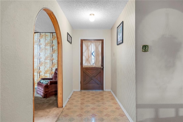 foyer with a textured ceiling