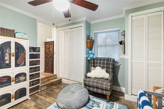 living area featuring ceiling fan, ornamental molding, and hardwood / wood-style floors