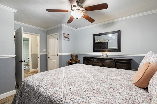 bedroom with ceiling fan, ornamental molding, and light hardwood / wood-style floors