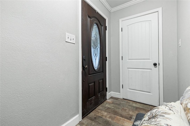 foyer entrance with dark hardwood / wood-style floors and crown molding