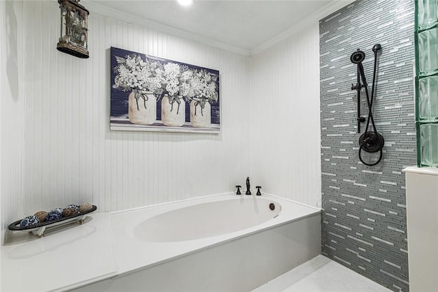 bathroom with a tub and ornamental molding