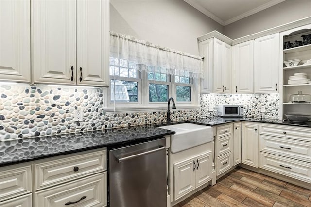 kitchen featuring dishwasher, sink, crown molding, white cabinetry, and dark hardwood / wood-style flooring