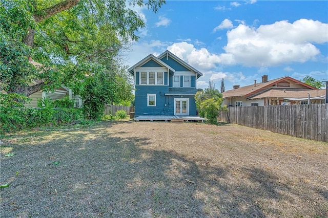 back of house with a wooden deck