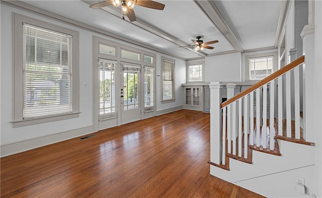 entryway featuring ceiling fan, beam ceiling, wood-type flooring, and crown molding