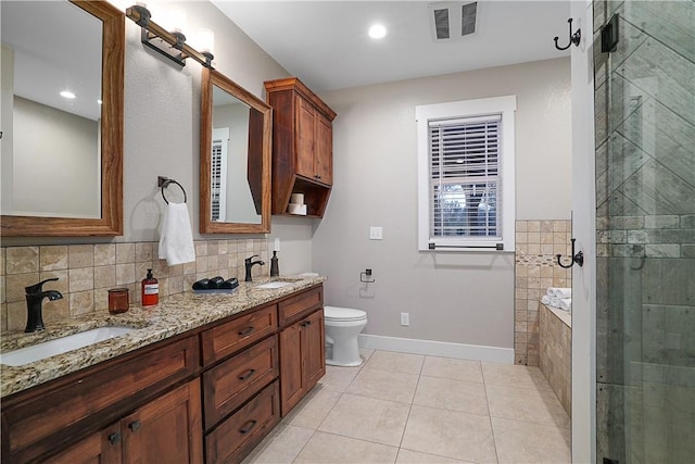 full bathroom with separate shower and tub, tile patterned flooring, vanity, and toilet