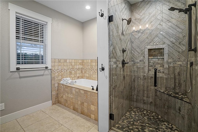 bathroom with tile patterned flooring and shower with separate bathtub