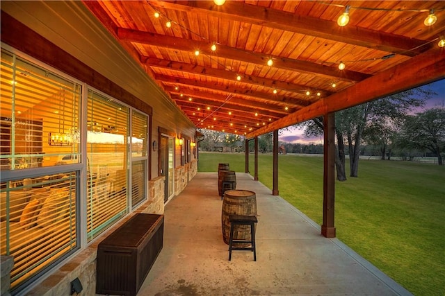 patio terrace at dusk with a yard