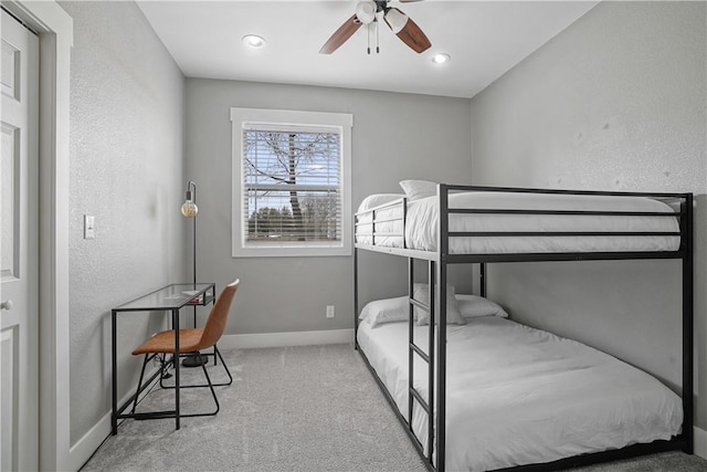 bedroom with light carpet and ceiling fan