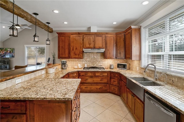 kitchen featuring backsplash, plenty of natural light, stainless steel appliances, and decorative light fixtures