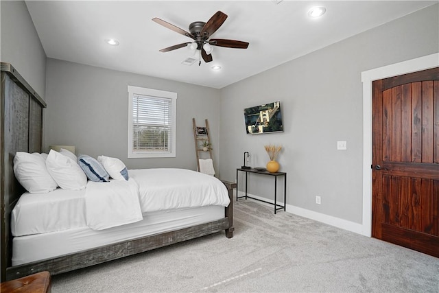 bedroom featuring ceiling fan and light colored carpet