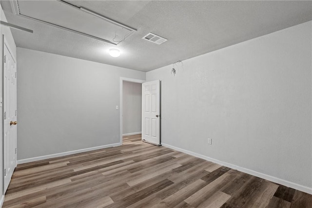 unfurnished room featuring hardwood / wood-style floors