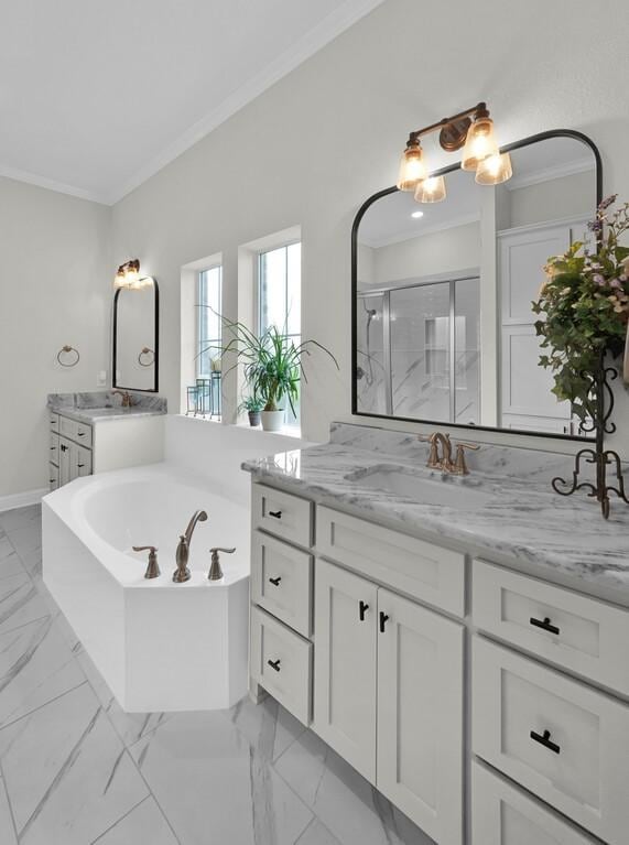 bathroom featuring vanity, shower with separate bathtub, and ornamental molding