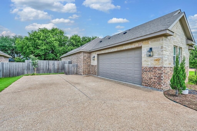 view of side of property with a garage