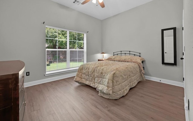 bedroom featuring ceiling fan and wood-type flooring