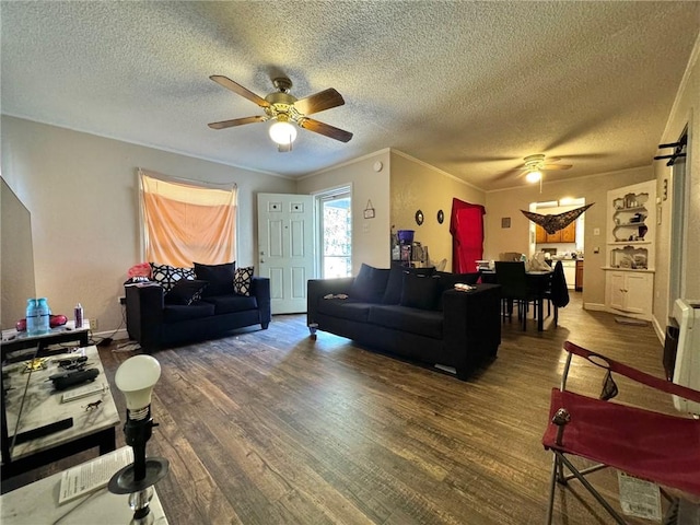 living room with hardwood / wood-style floors and a textured ceiling