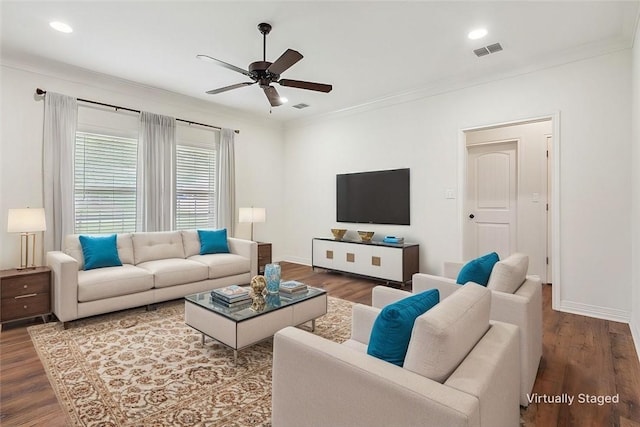 living room featuring ceiling fan, wood-type flooring, and ornamental molding