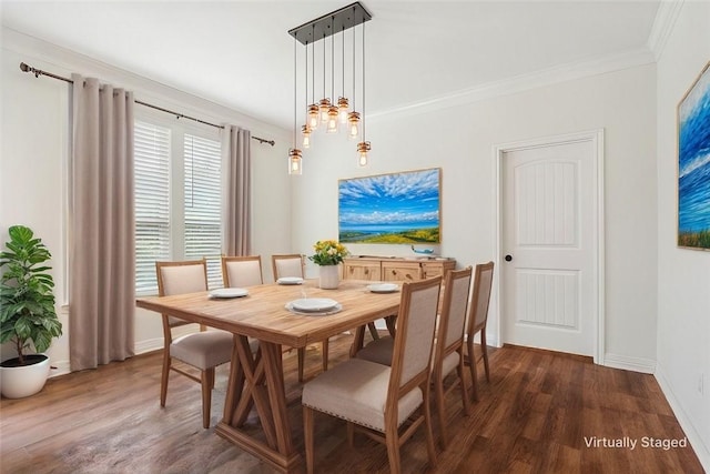 dining room with dark hardwood / wood-style floors and ornamental molding