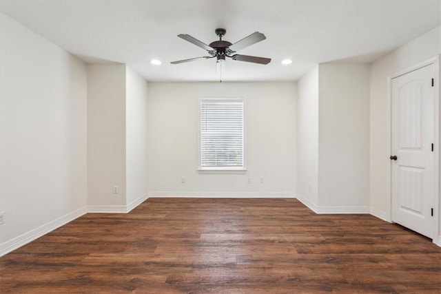 empty room featuring dark hardwood / wood-style floors and ceiling fan