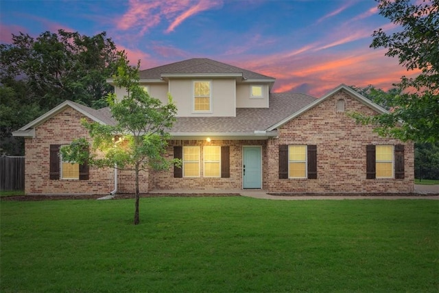 view of front of property with a yard