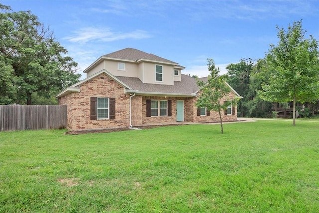 back of house with a lawn