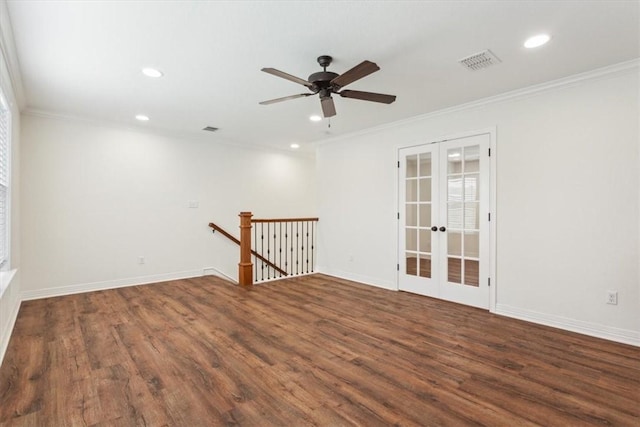 unfurnished room featuring crown molding, dark wood-type flooring, and french doors