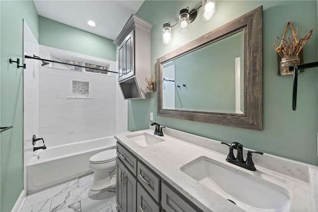 full bathroom with tiled shower / bath combo, toilet, and vanity