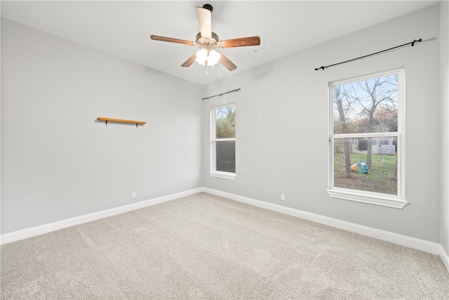 empty room with carpet and ceiling fan