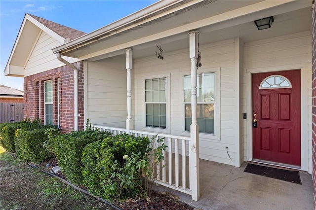 doorway to property featuring a porch