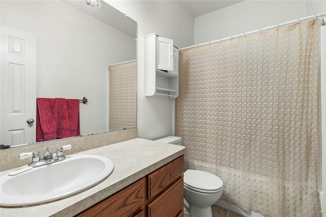 full bathroom featuring vanity, shower / bath combo, and toilet