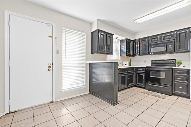 kitchen featuring light tile patterned floors and black appliances