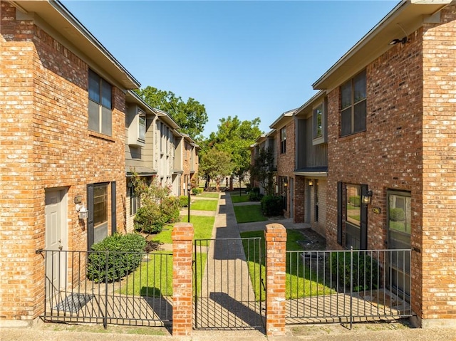 view of property's community with a yard