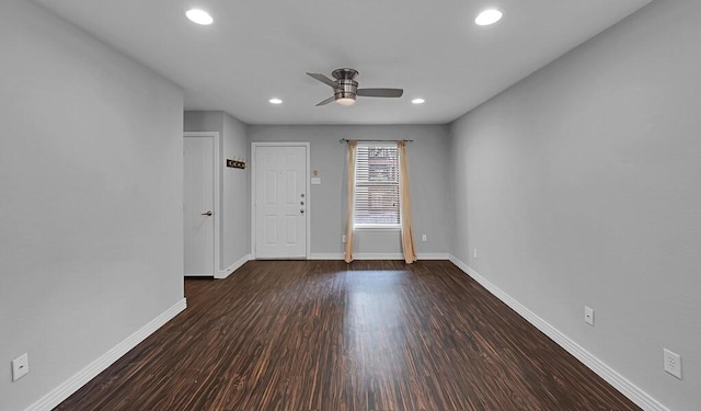 spare room featuring recessed lighting, baseboards, wood finished floors, and ceiling fan