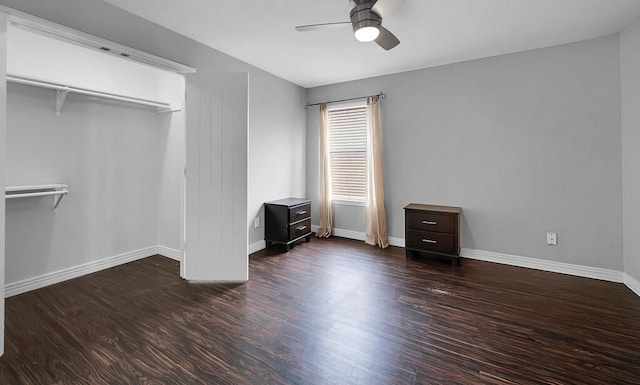 unfurnished bedroom with wood finished floors, baseboards, and ceiling fan