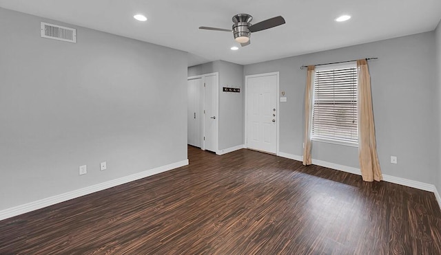 spare room with baseboards, visible vents, recessed lighting, ceiling fan, and dark wood-type flooring