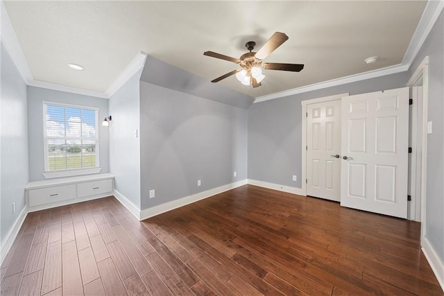 unfurnished bedroom featuring ceiling fan, dark hardwood / wood-style floors, and ornamental molding