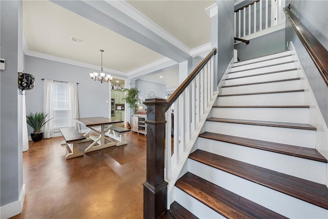 foyer featuring a notable chandelier and crown molding