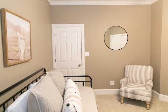 sitting room with ornamental molding, carpet flooring, and baseboards