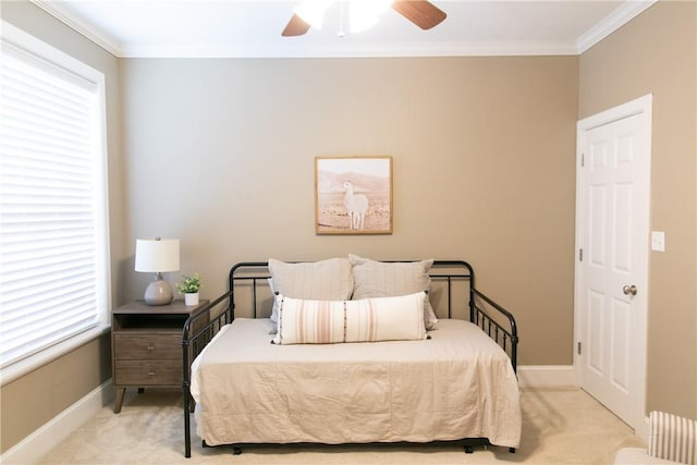 bedroom featuring carpet, multiple windows, and crown molding