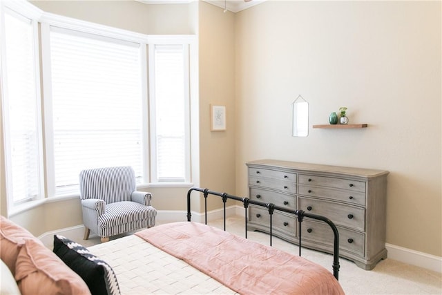 carpeted bedroom featuring baseboards