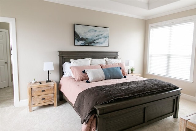 bedroom with ornamental molding, light colored carpet, and baseboards