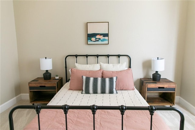 carpeted bedroom with baseboards