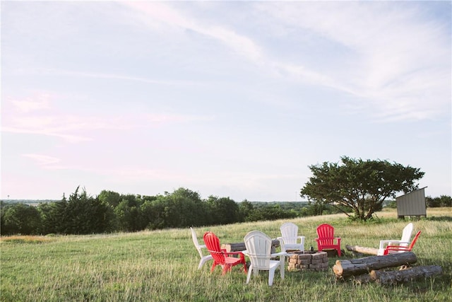 view of yard with a fire pit