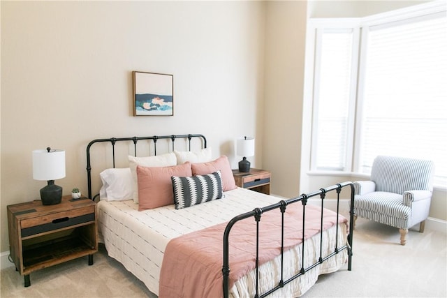 bedroom with light colored carpet