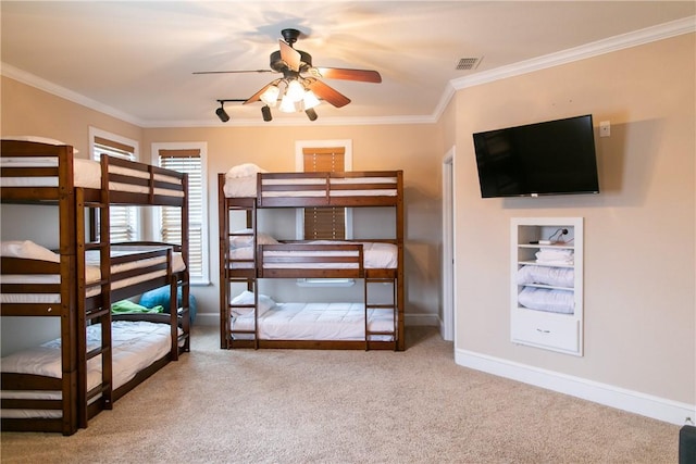 unfurnished bedroom featuring ornamental molding, carpet flooring, and visible vents