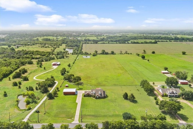 birds eye view of property with a rural view