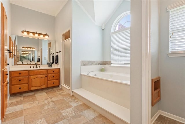 bathroom with vanity, crown molding, lofted ceiling, and shower with separate bathtub