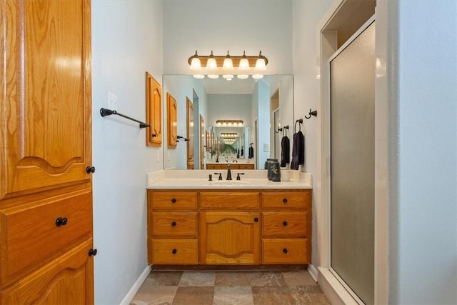 bathroom featuring vanity and an enclosed shower