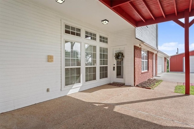 view of patio featuring a garage